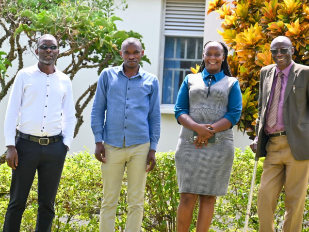 Jean Bosco Mbonyumuvunyi  Second from the Left