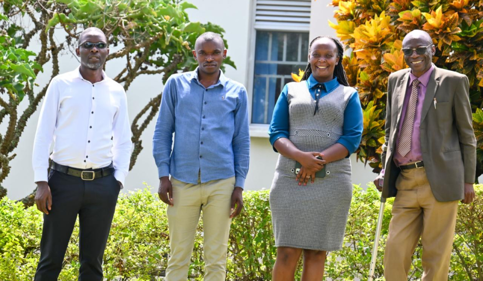 Jean Bosco Mbonyumuvunyi  Second from the Left
